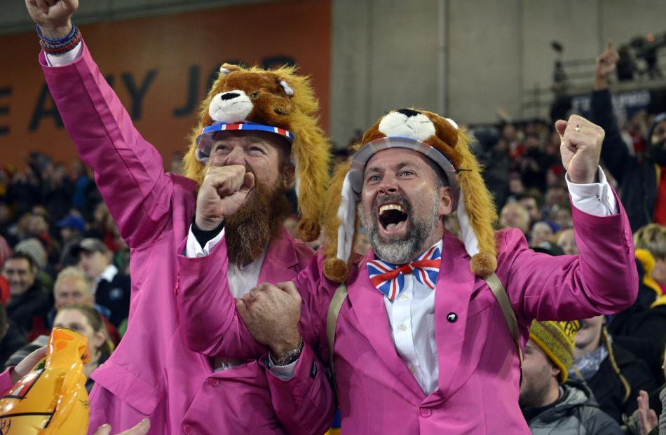 A couple of Lions fans cheer on their team at Forsyth Barr Stadium. PHOTO: GERARD O’BRIEN