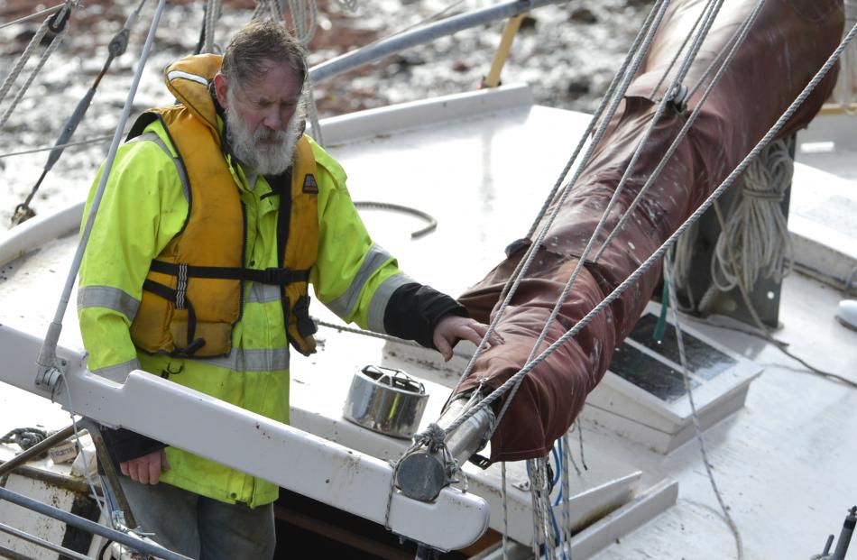 Guy Garey inspects his yacht for damage.