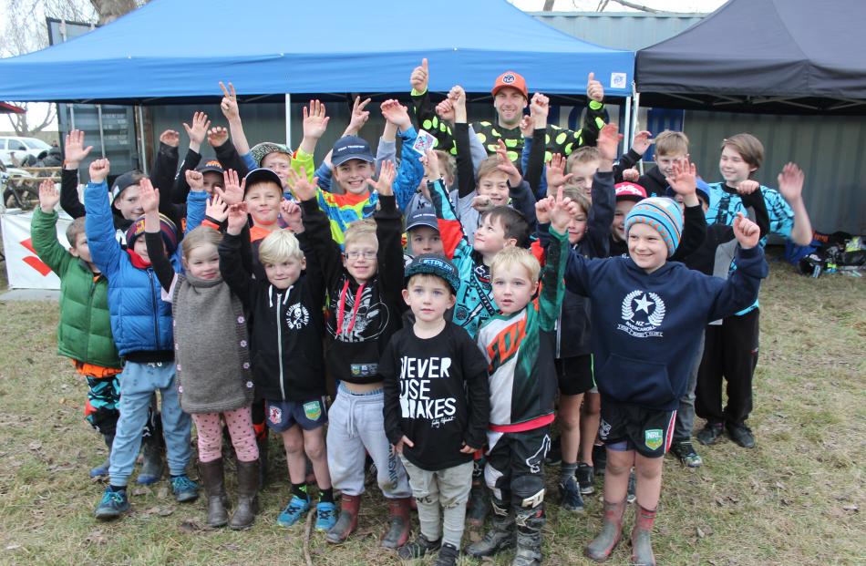 A group of motocross fans show their excitement at meeting international and professional motocross star Ben Townley at the Hasler Memorial Trophy Motocross race yesterday.