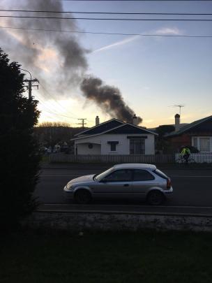 Smoke of a house fire in Oxford St, South Dunedin. Photo: Hayley De Filippi-Hill