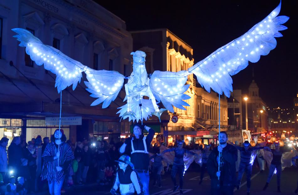 Performers control an eagle light puppet for the Nocturnal animals themed carnival. Photo: Gregor...