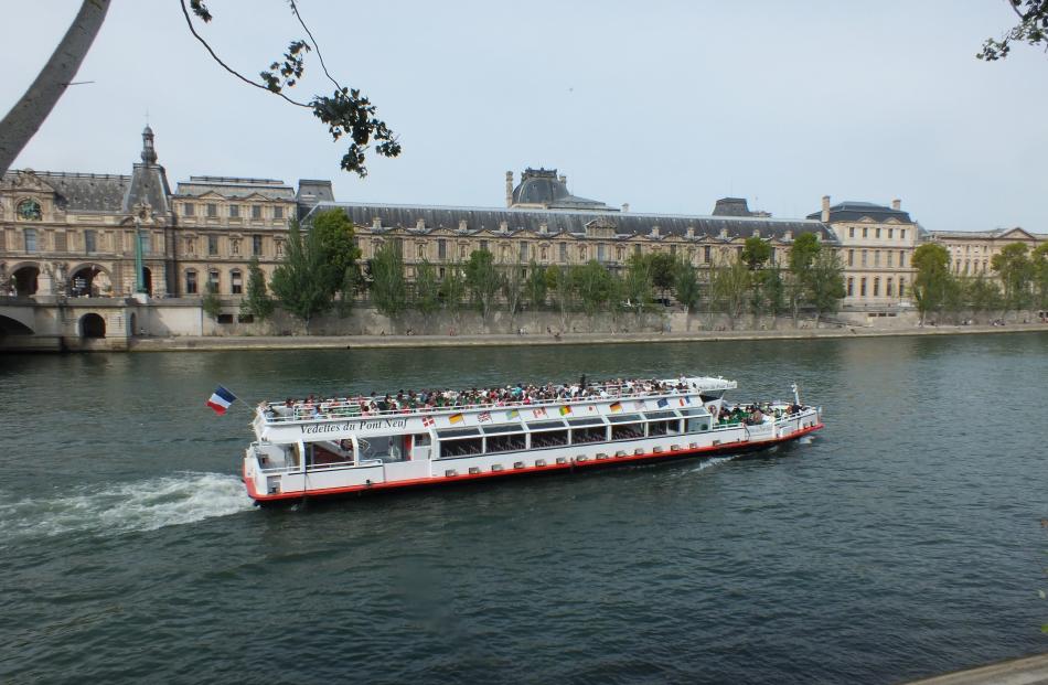 Travel the Seine by boat; the Louvre is in the background.














