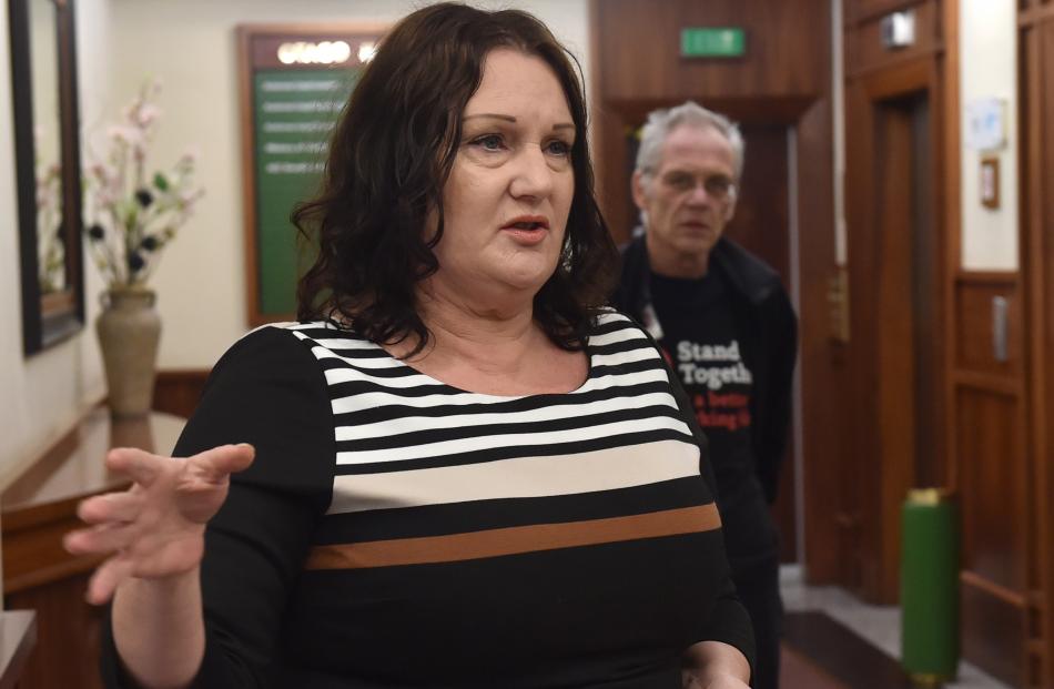 Patrice Harrex, accompanied by union organiser Jon Henning, delivers the Public Service...