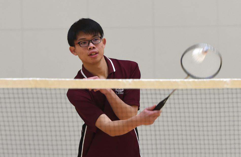 Kevin Chung (18) Logan Park High School plays in a Badminton match at Bayfield High School.