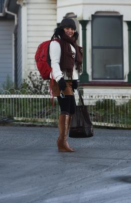 University of Otago student Leida Dos Santos, of Brazil, struggles to cross London St yesterday....