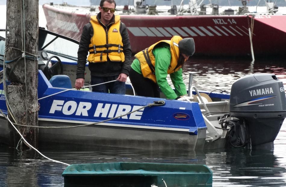 Queenstown businessman Max Perkins and Department of Conservation community ranger Nicole...