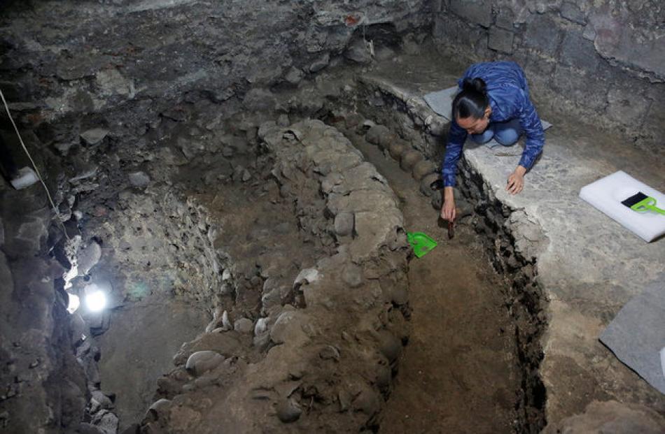 The tower is believed to form part of the Huey Tzompantli, a massive array of skulls that struck fear into the Spanish conquistadores when they captured the city. Photo: Reuters