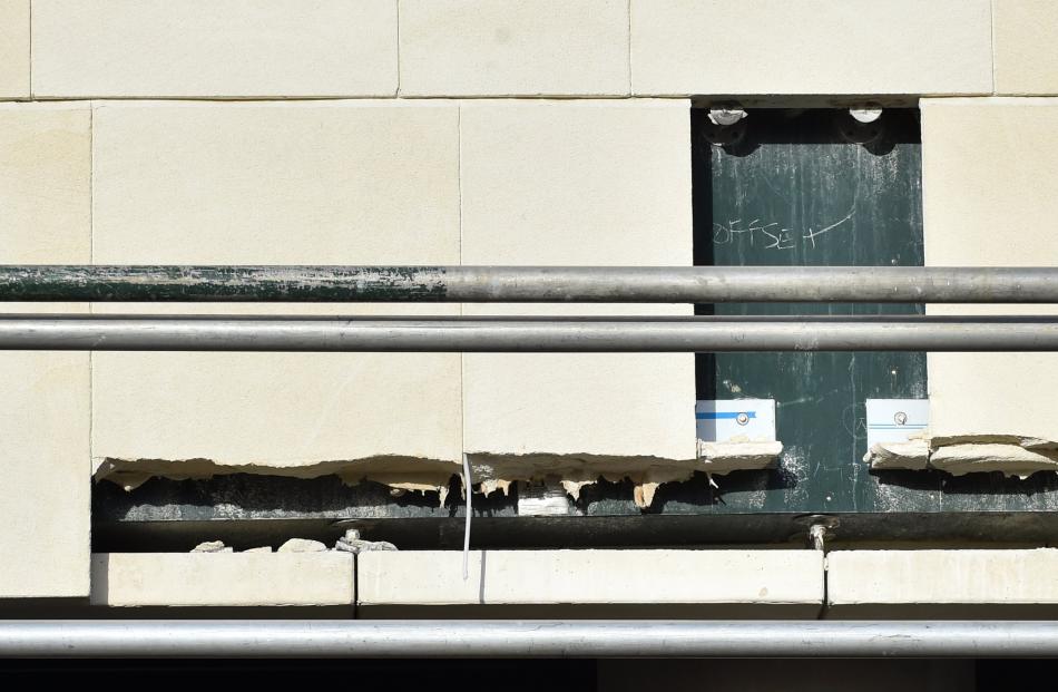 Cracks in the stonework of the University Plaza building.