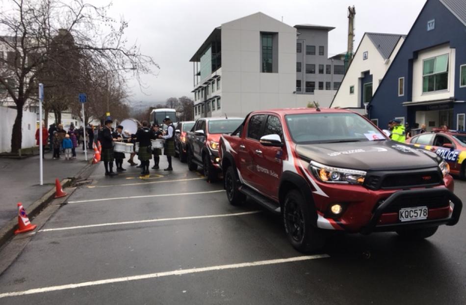 The cars getting ready to escort the team. Photo: Peter McIntosh