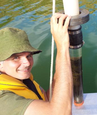 Dr Schallenberg with sediment core retrieved to study in-lake phosphorus recycling in 2014. Photo...