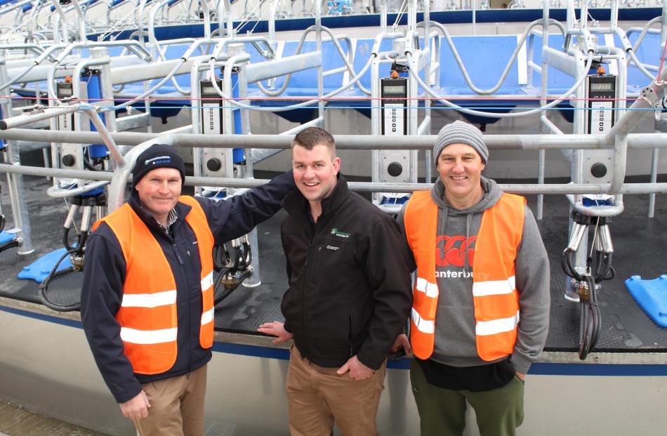 Southern Dairy Hub business manager Guy Michaels (left) and farm manager Jason Phillips with Southern Dairy Development Trust chairman Tony Miles in the milking shed of the new facility during the official opening on Friday. Photos: Petrina Wright