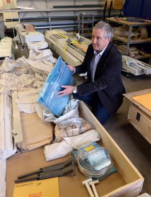 Otago Polytechnic principal engineering lecturer Stuart Allan opens crates containing a Vans RV12 kitset plane which will be built by students. Photo: Linda Robertson