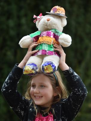 Talia Familton  (7), of Oamaru, holds up her teddy, Jess, at the Larnach Castle teddy bears’...