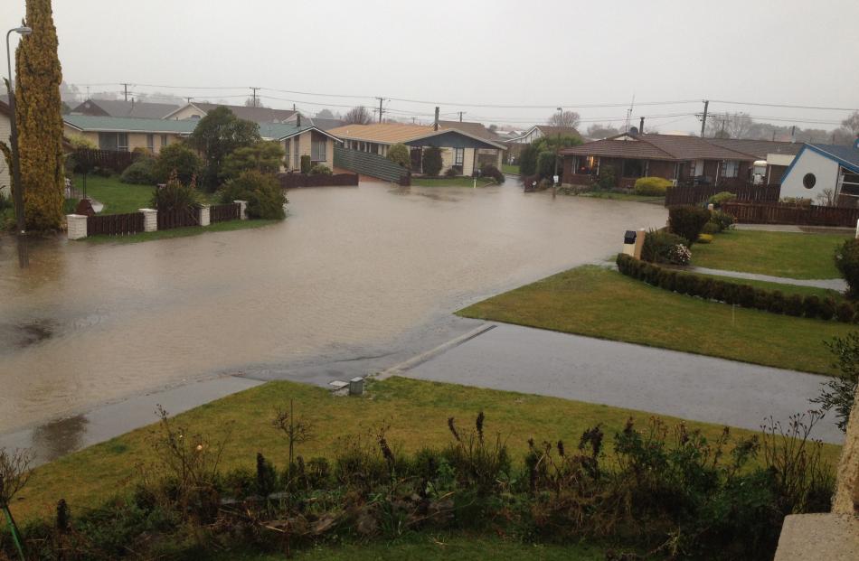 Otter Street in Oamaru has flooded. Photo: Hayden Meikle