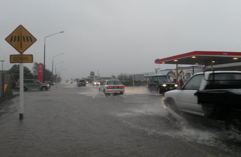 Thames highway is flooded at the intersection of Arundel St in Oamaru. Photo: Shannon Gilllies