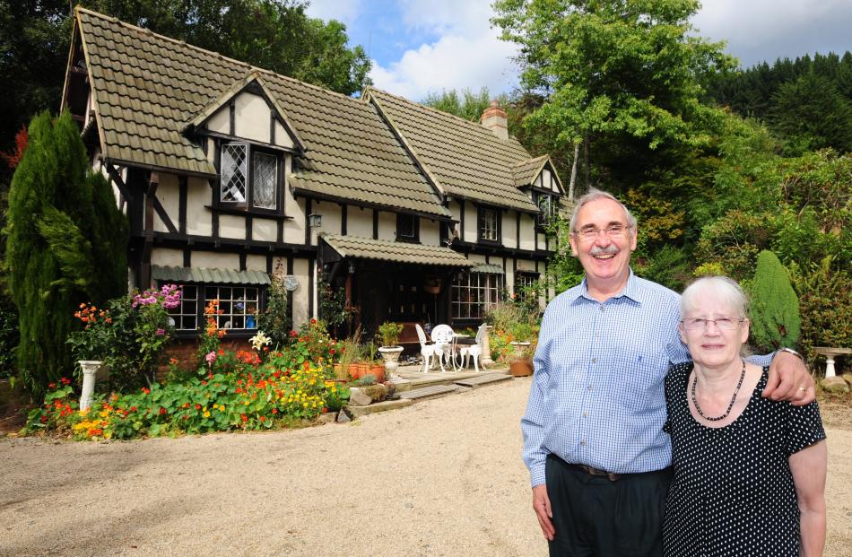 Mr Sasse and his wife, Elizabeth, outside the house in 2009. Photo: ODT files