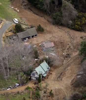 A massive slip surrounded Gordon Sasse's Blanket Bay home on Saturday morning. Photo: Gerard O'Brien