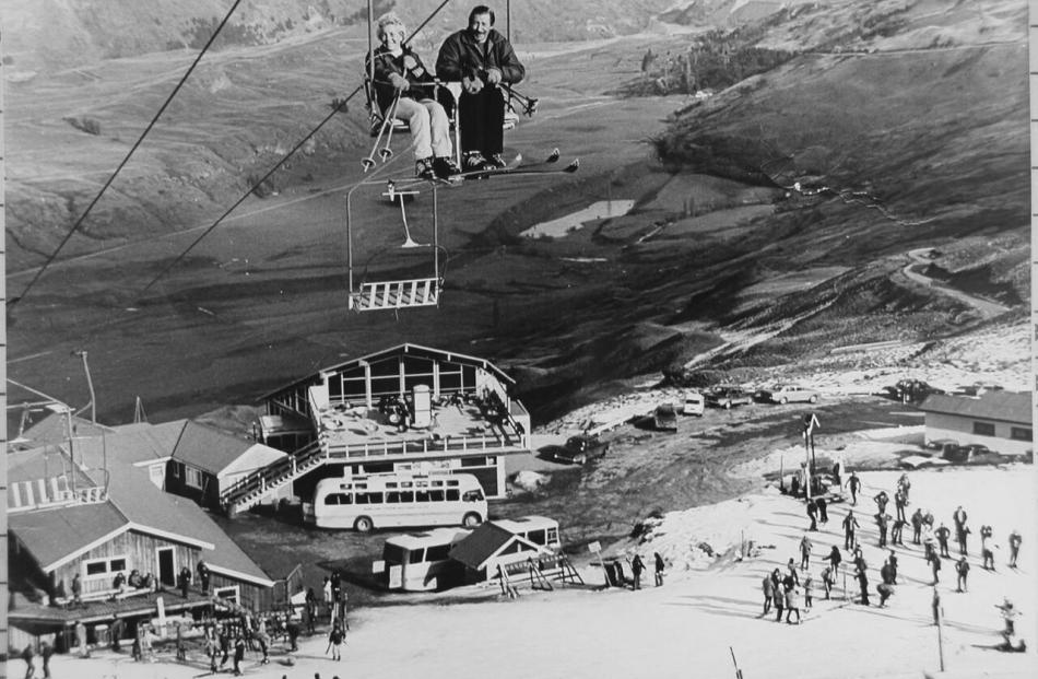 Sir Henry Wigley and his wife, Isabella, Lady Wigley, ride a chairlift at Coronet Peak in the...