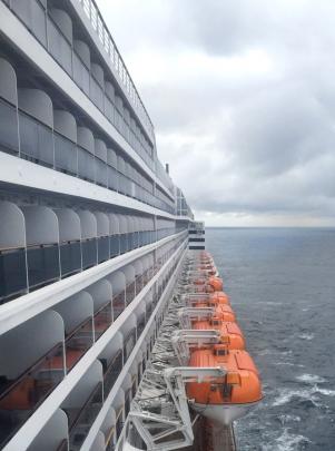 Deck and lifeboats on board Queen Mary 2 as it crosses the Atlantic.