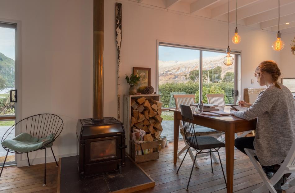 Emma-Kate Moore (33) works at her kitchen table inspired by the views of Kingston from her...