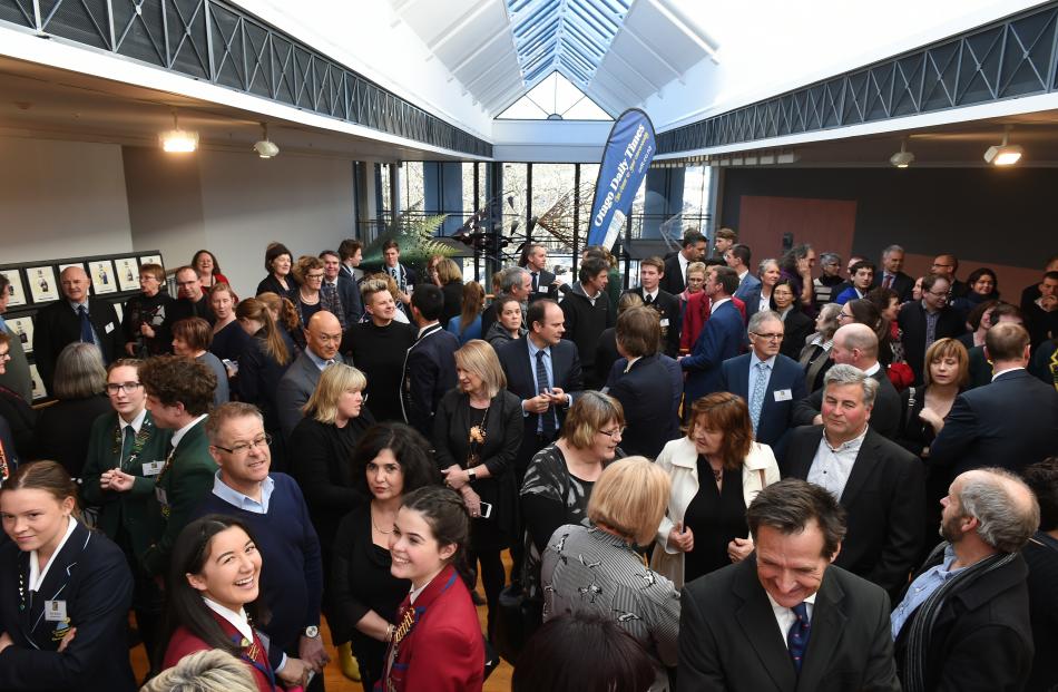 Parents and pupils mingle.
