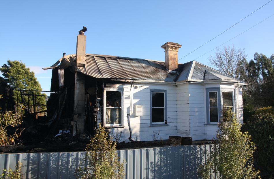 What remains of the house in Herbert on State Highway 1 after a fire tore through the building in...