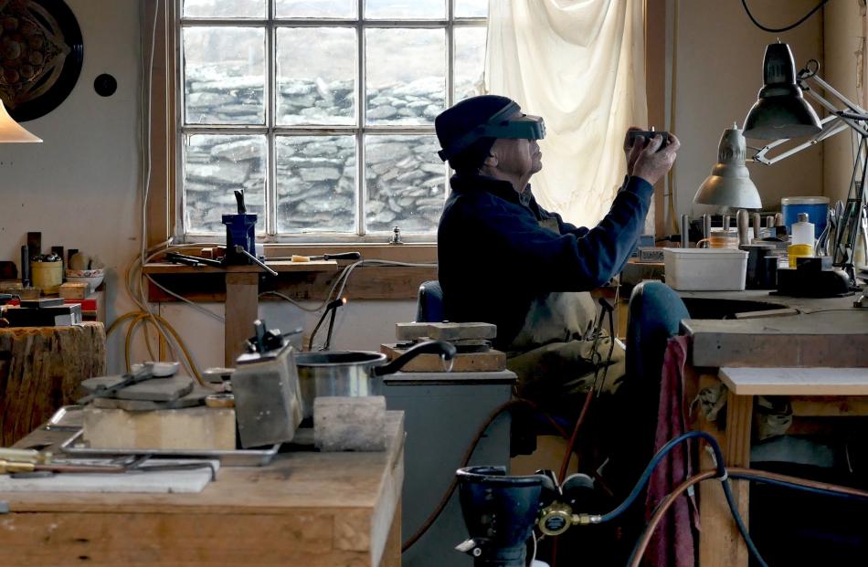 Swiss jeweller Kobi Bosshard at work in his Middlemarch studio. Photos: Supplied