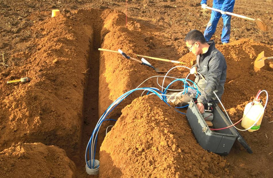 A Plant and Food researcher installs a flux meter as part of the Foundation for Arable Research nutrient-loss data-collection project. Photos: Supplied