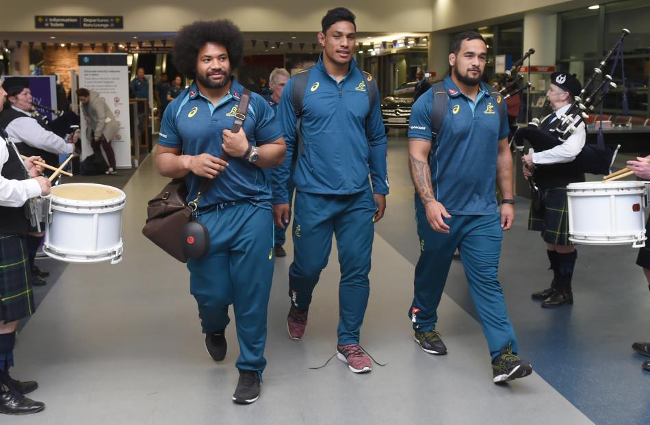 Wallabies forwards (from left) Tatafu Polota-Nau, Lopeti Timani and Tetera Faulkner walk through Dunedin Airport during a low-key welcome for the team last night. Photos: Gregor Richardson