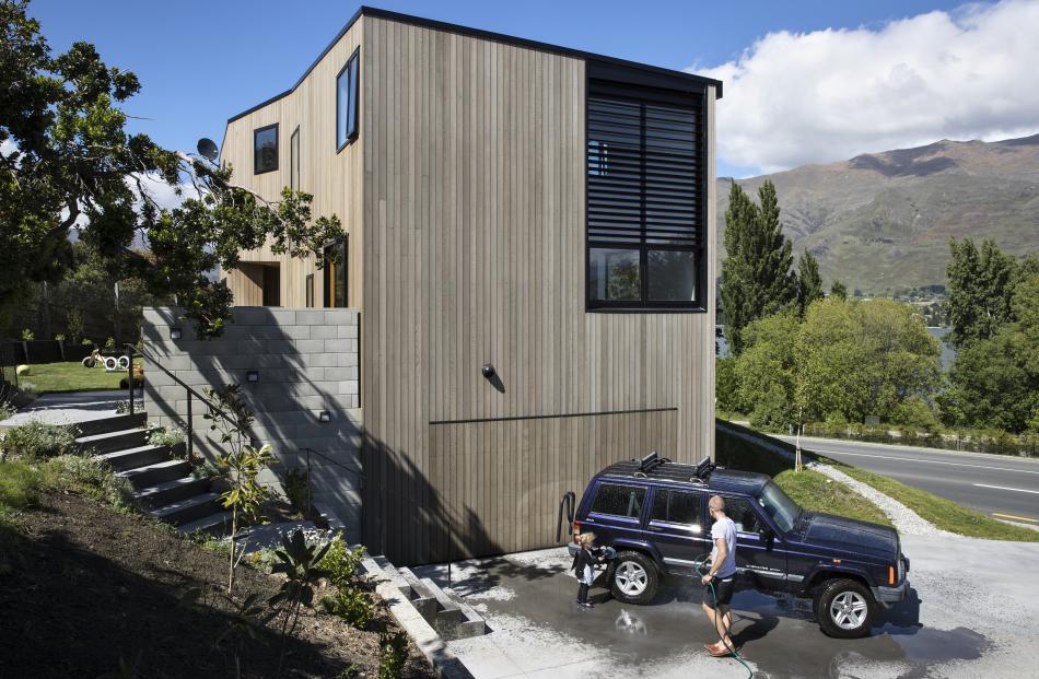 On the north side, the home has a garage at ground level and a single large window that lights...