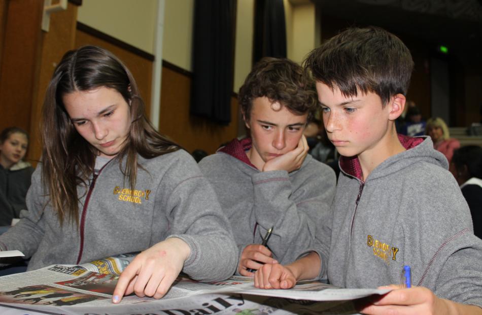Glenorchy School pupils Sahara Hood (13, left), Jack Higgins (13) and Harvey Davis catch up on...