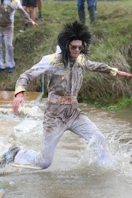 Balclutha resident Ben Cameron, dressed as Elvis Presley as one of the ``Filthy Fathers'',...