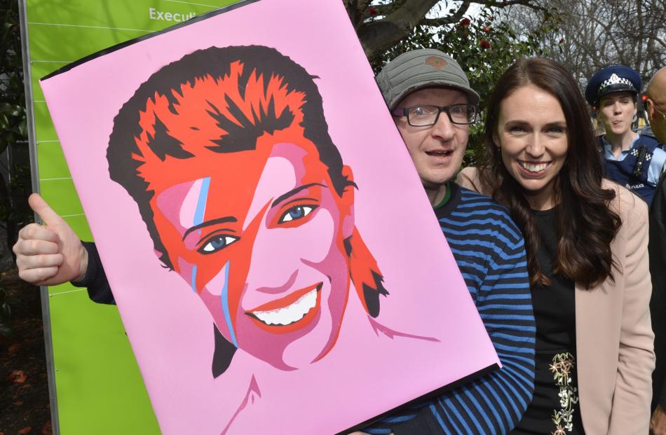 Dunedin artist Sam Sharpe with his Ziggy Stardust based image of Jacinda Ardern at the University...