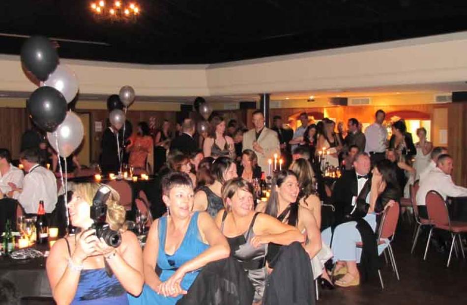 The audience turns to watch local band, Groova, take the spotlight.
