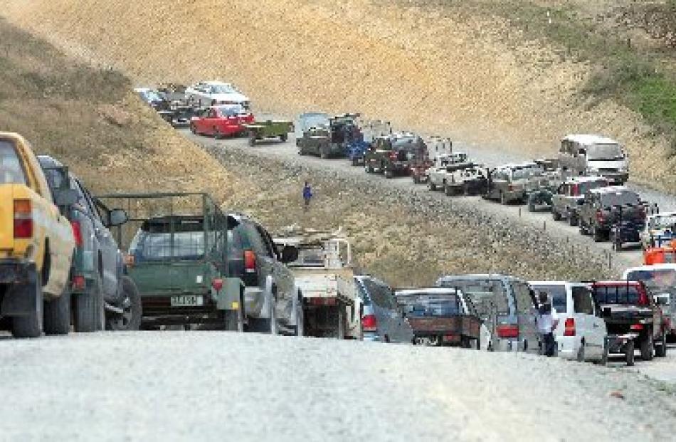 About 200 vehicles queue at Wenita Forest Products firewood sale yesterday.
