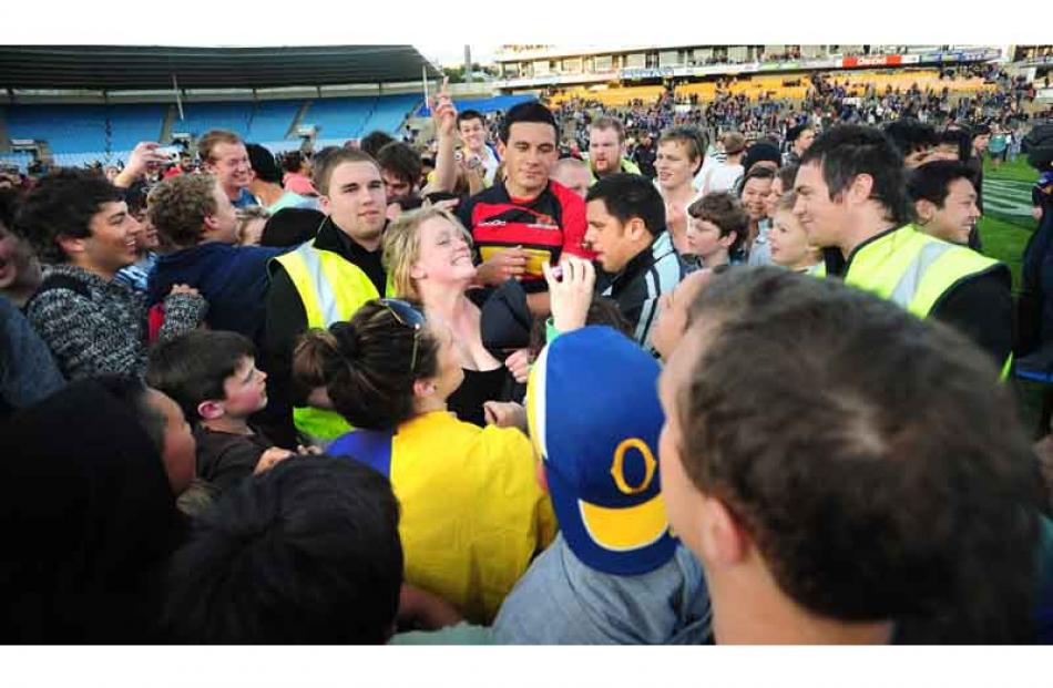 Canterbury's Sonny Bill Williams signs autographs.
