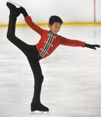 Dwayne Li (8), a guest skater from China, shows his style.