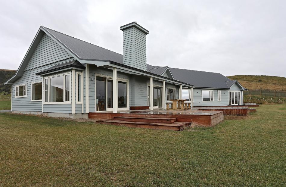 This farmhouse 25km from Gore has timber decks to make the most of the rural views. Skylights in...