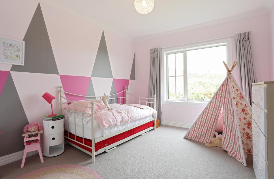 Triangular vinyl decals decorate 4-year-old Trelise’s room. Mrs Evans saw a similar idea on...