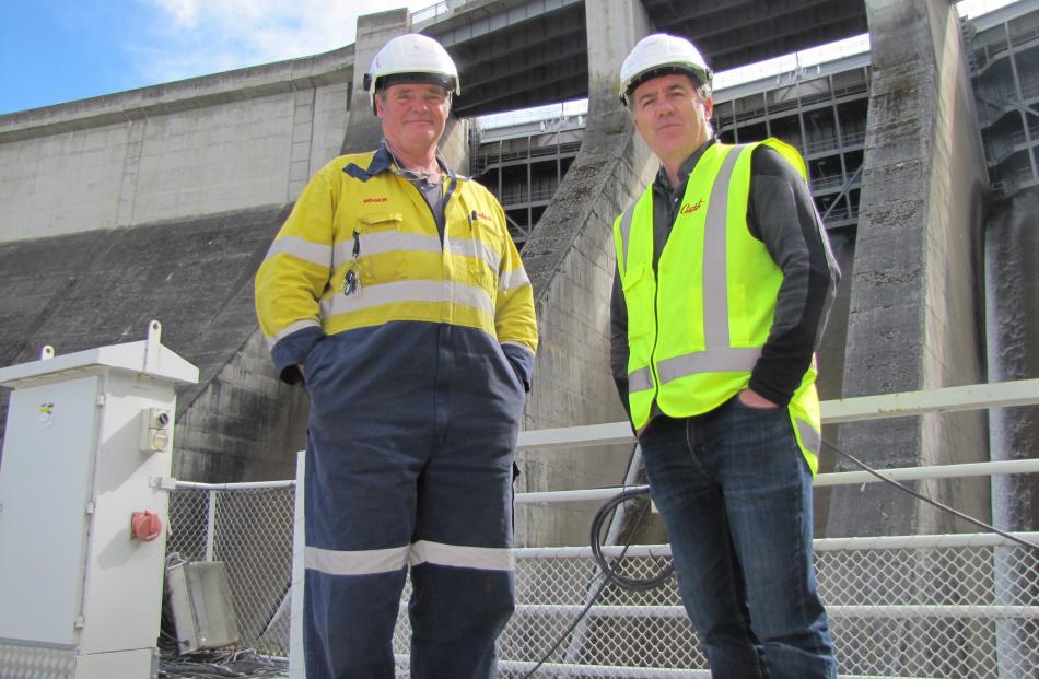 Roxburgh Dam generation technician Roger Calverley (left) and Contact Energy head of hydro...