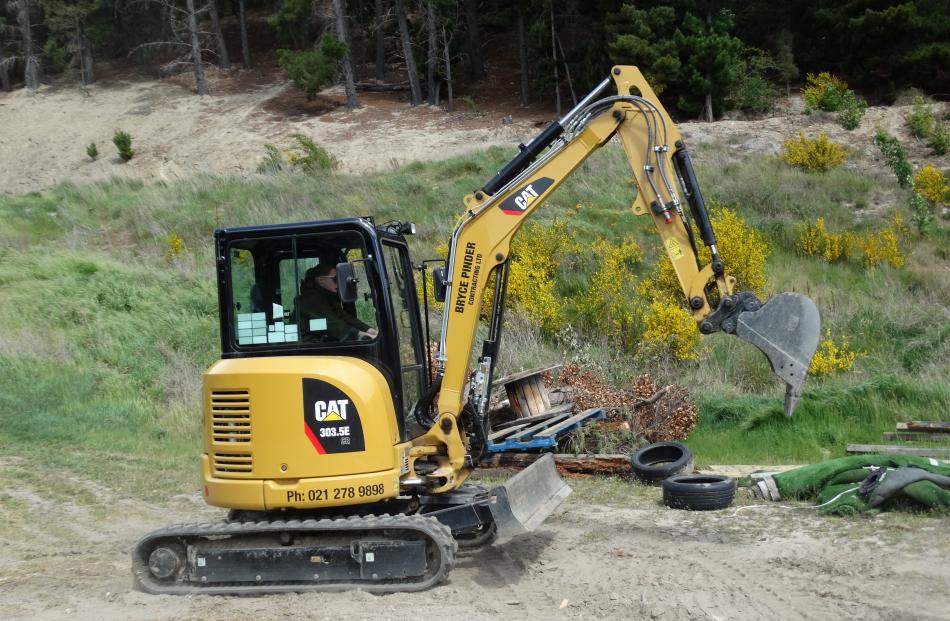 Emily Menzies (29) drives a digger for the first time, one of the Perfect Woman challenges. 