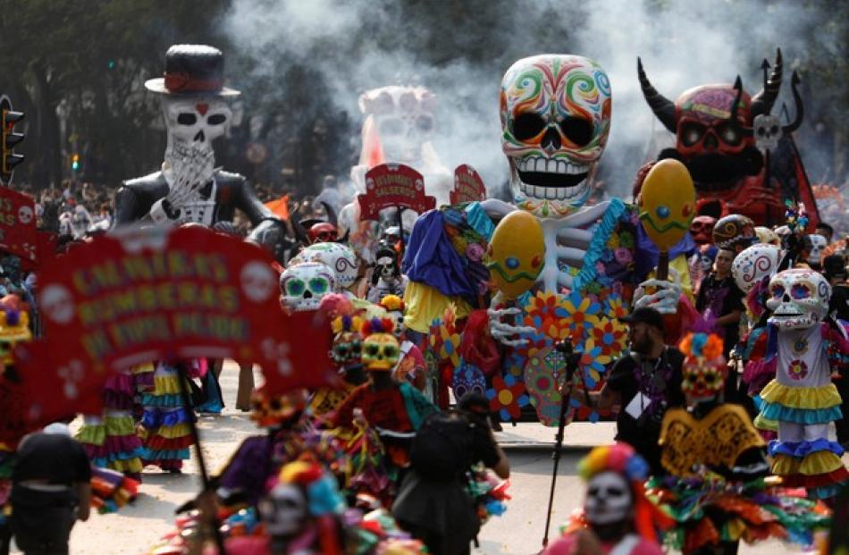 Sponsored by Mexico's tourism and culture ministries, the parade was triple the size of last year's maiden effort, inspired by a Day of the Dead parade featured in the opening sequence of the 2015 James Bond film "Spectre." Photo: Reuters