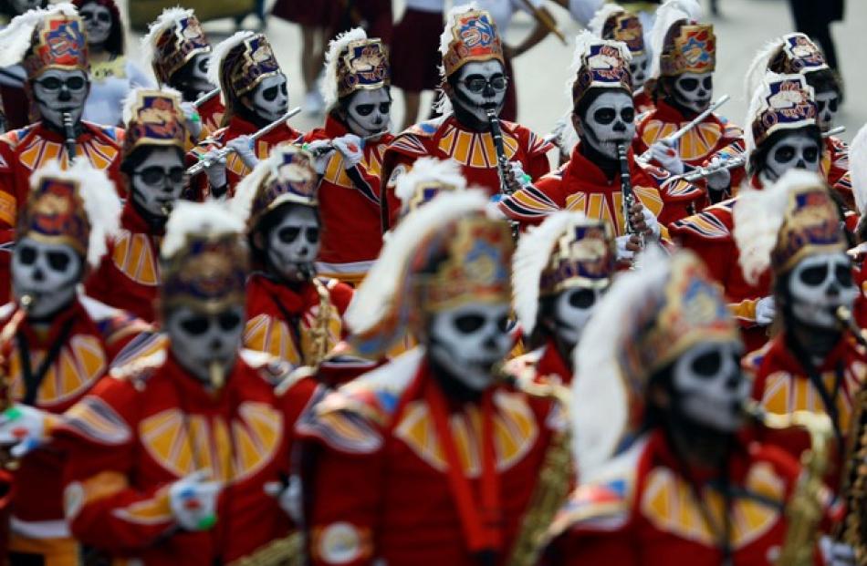 More than 700 performers prepared for months for the colourful afternoon procession along more than 7km of the expansive Paseo de la Reforma. Photo: Reuters