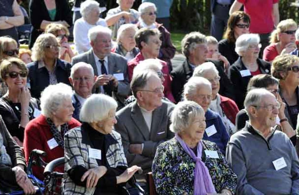 Former pupils enjoy a performance by current pupils.