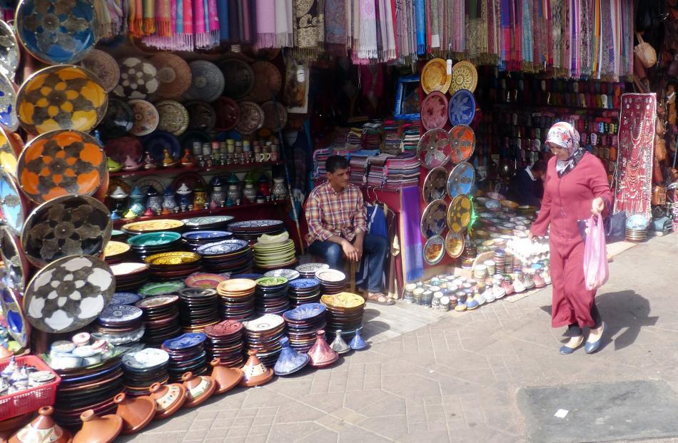 Marrakech is a busy modern city, but the more interesting part is the old market area where...