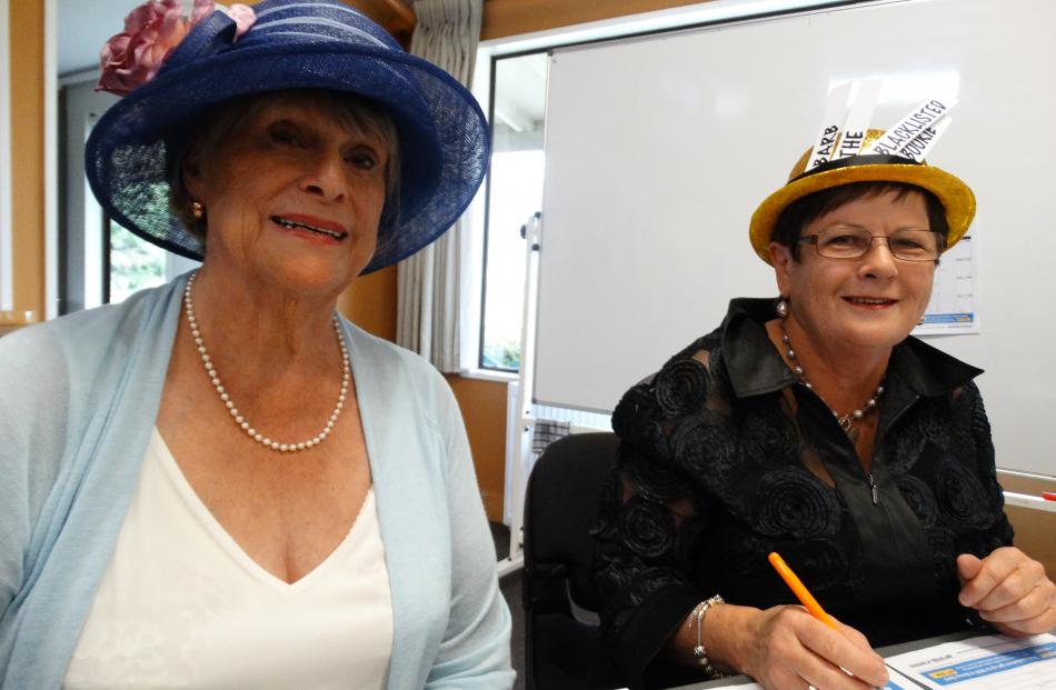 Enjoying Melbourne Cup ‘‘Hawea Style’’ at the Hawea Community Centre yesterday are Denise Brown (the Banker) and Barbara Mackenzie (Barb the Blacklisted Bookie), both of Hawea.