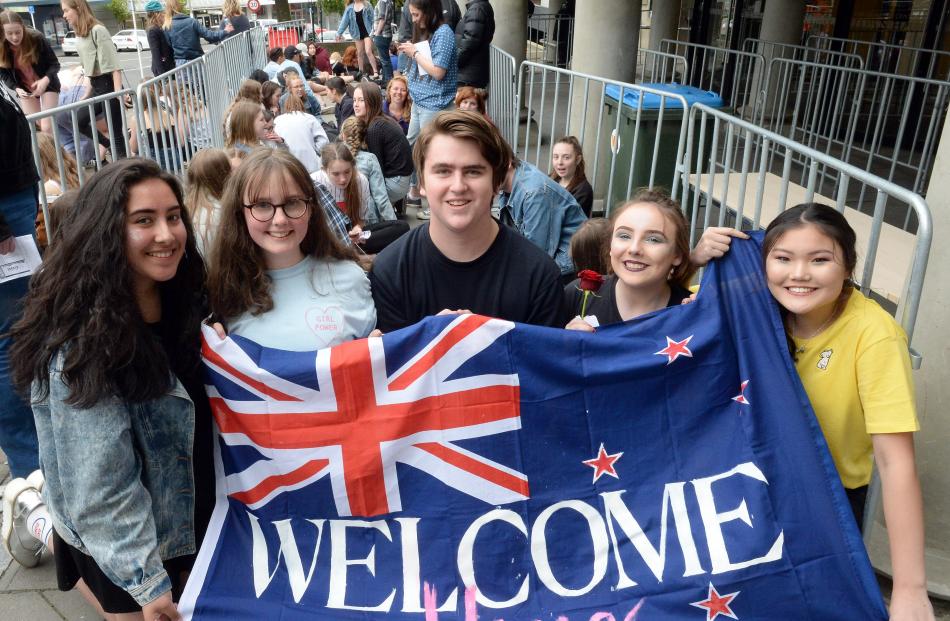 Lorde fans Bella Sefo (15), Sofia Till (15), Isaac Rijlaarsdam (17), Beth Moody (16) and Sennah Lee (16) hold a welcome banner after waiting all day for their favourite New Zealand performer. Photo: Linda Robertson
