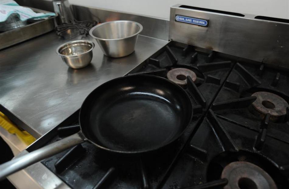 Refold the cloth so a clean surface is outermost and rub around the inside and outside of the pan...