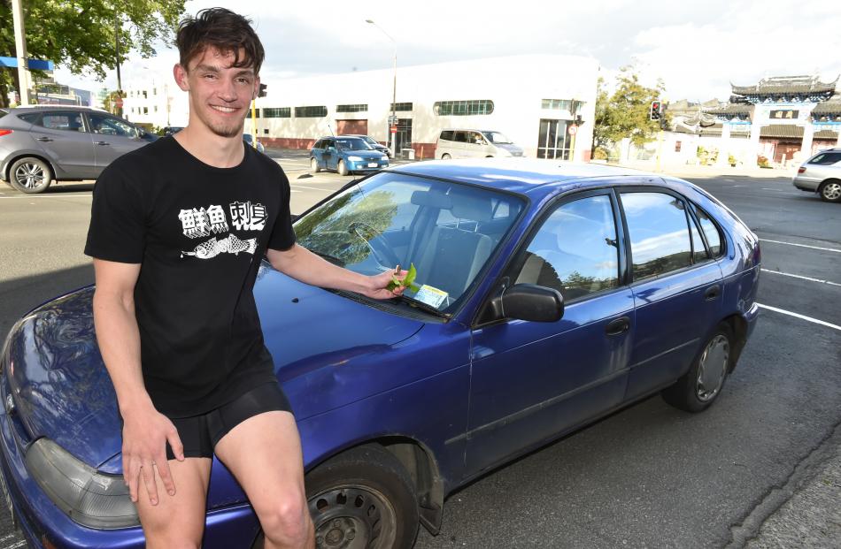 Dunedin student Scott Bezett (20), and his damaged car. Photos: Gregor Richardson
