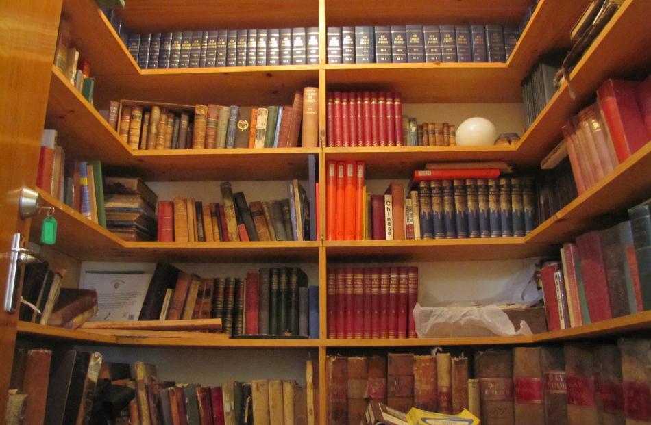 Old books and records line shelves in the main Clyde museum building.